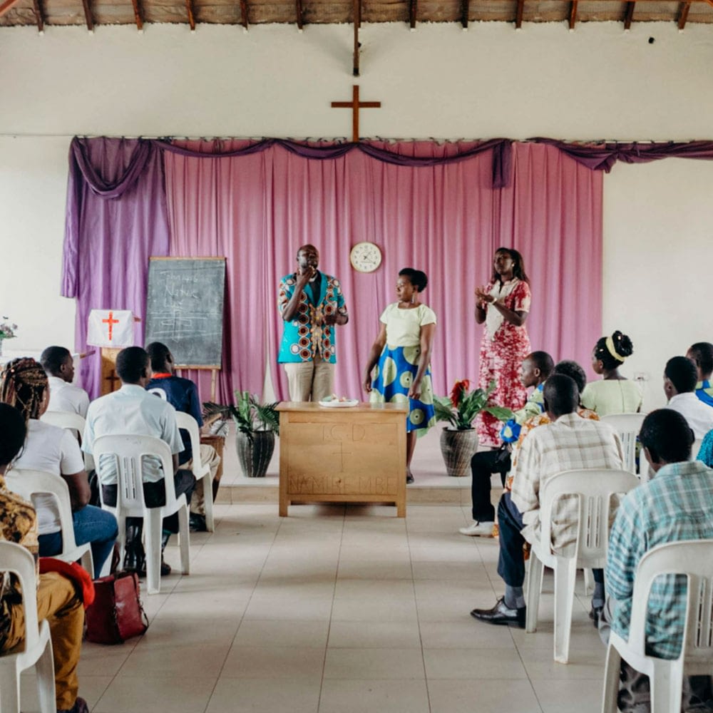 People at church having a prayer service