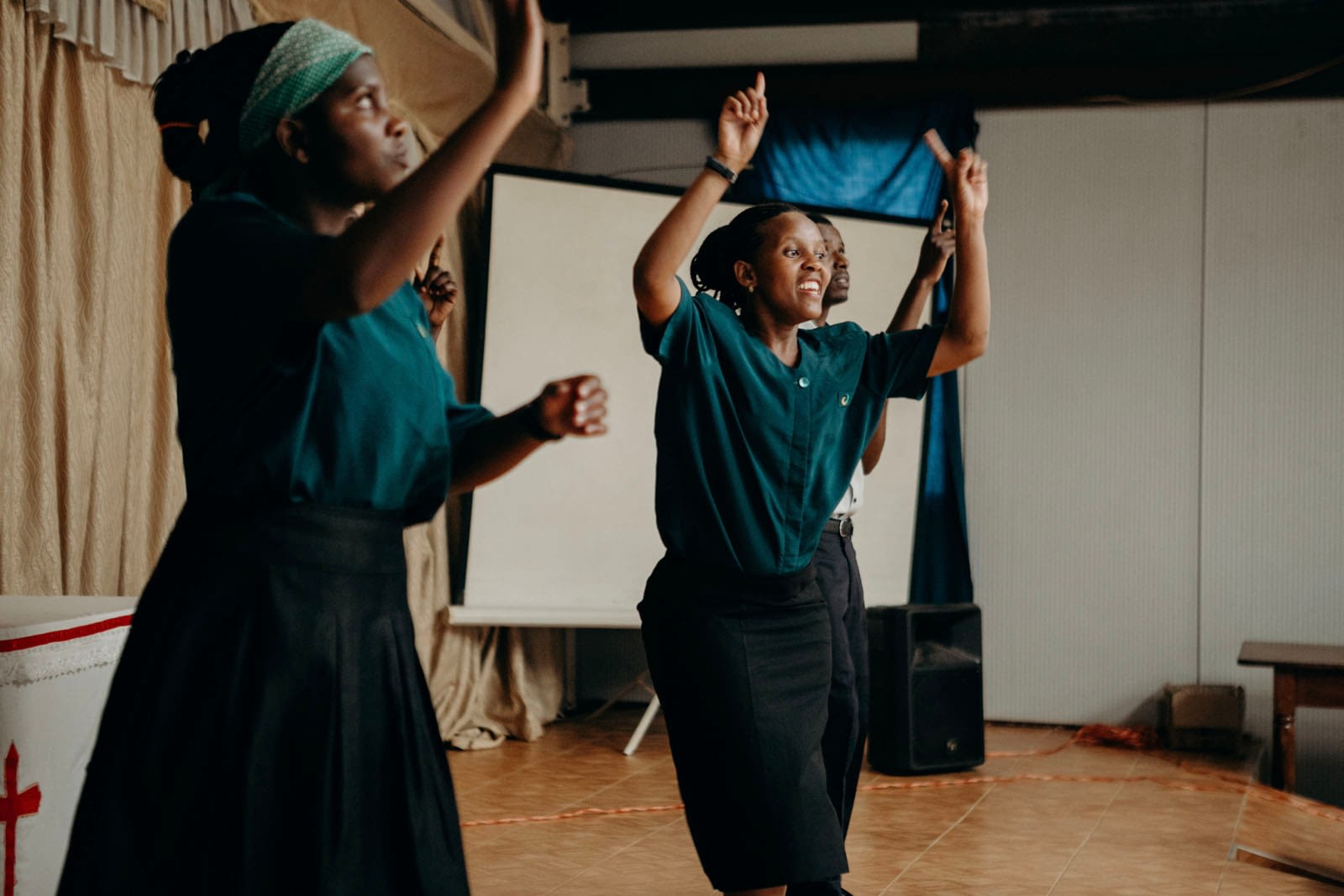 Group performing a dance with enthusiasm.