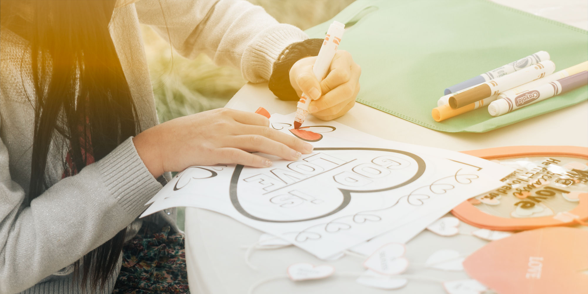Child doing a craft with markers