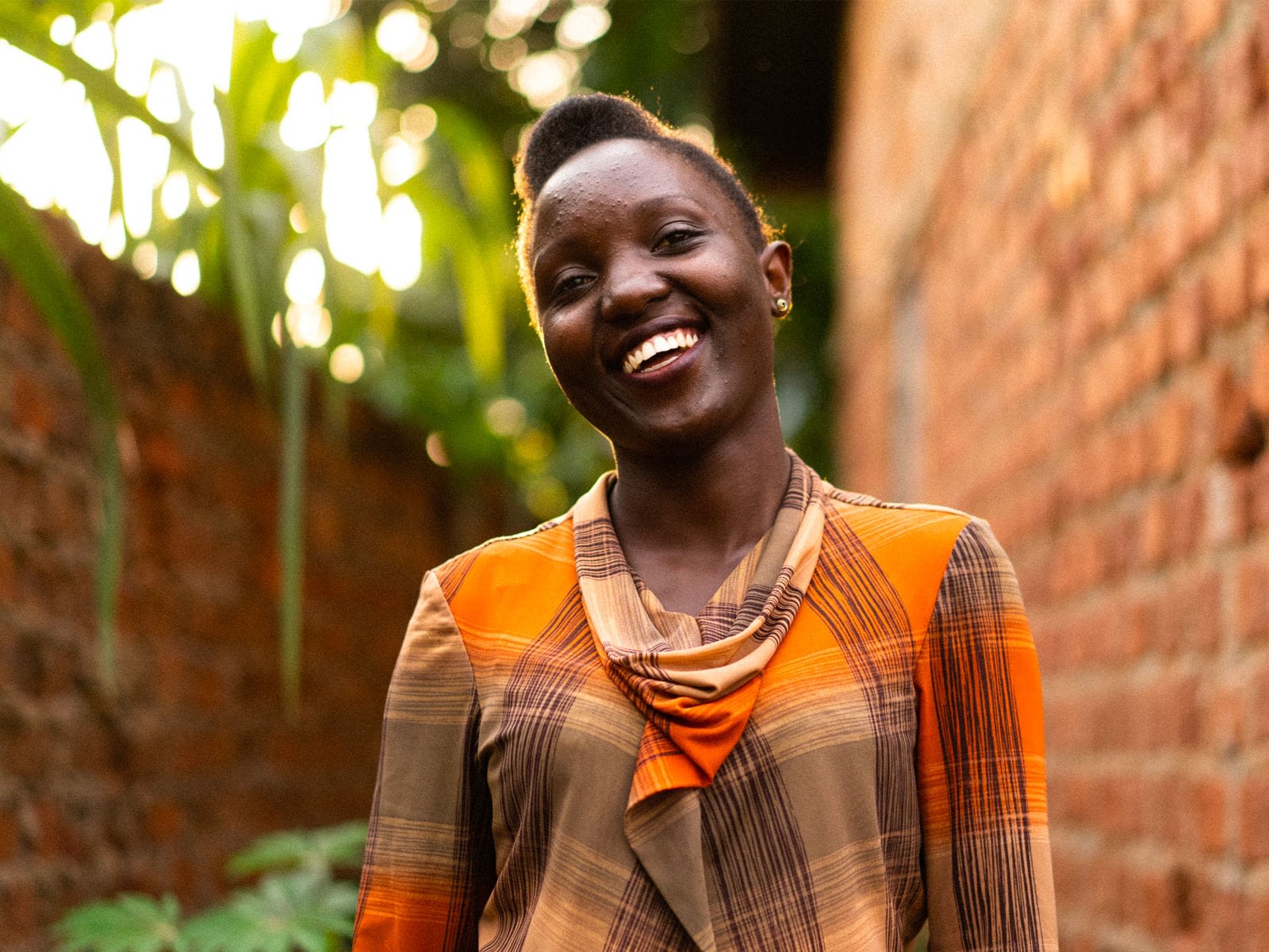 Amina smiles for a photo.