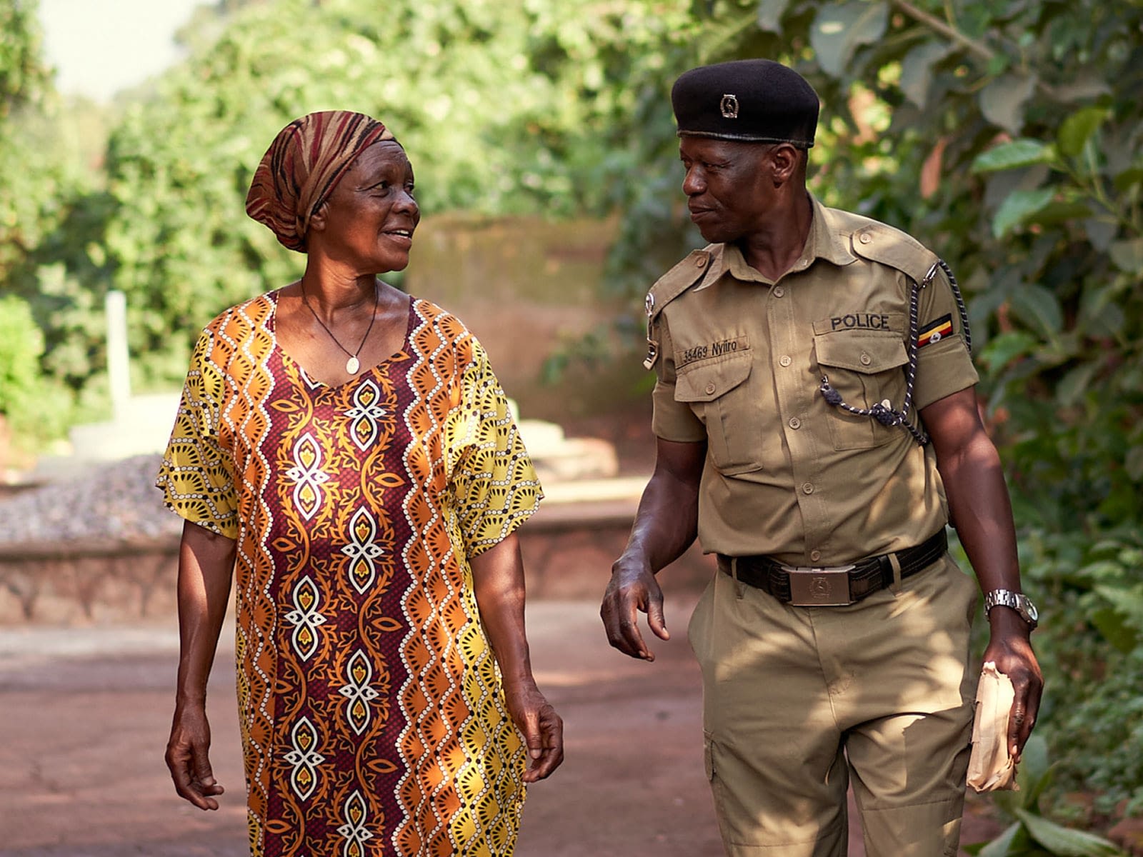 Law enforcement officer walking with a woman