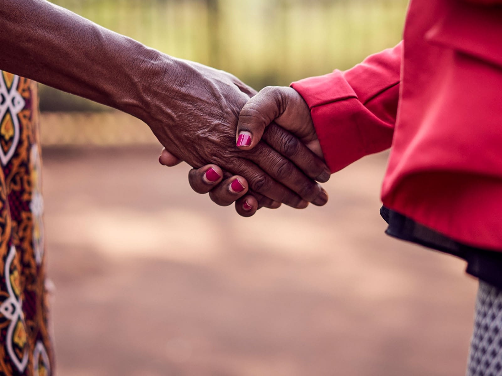 Two women shaking hands