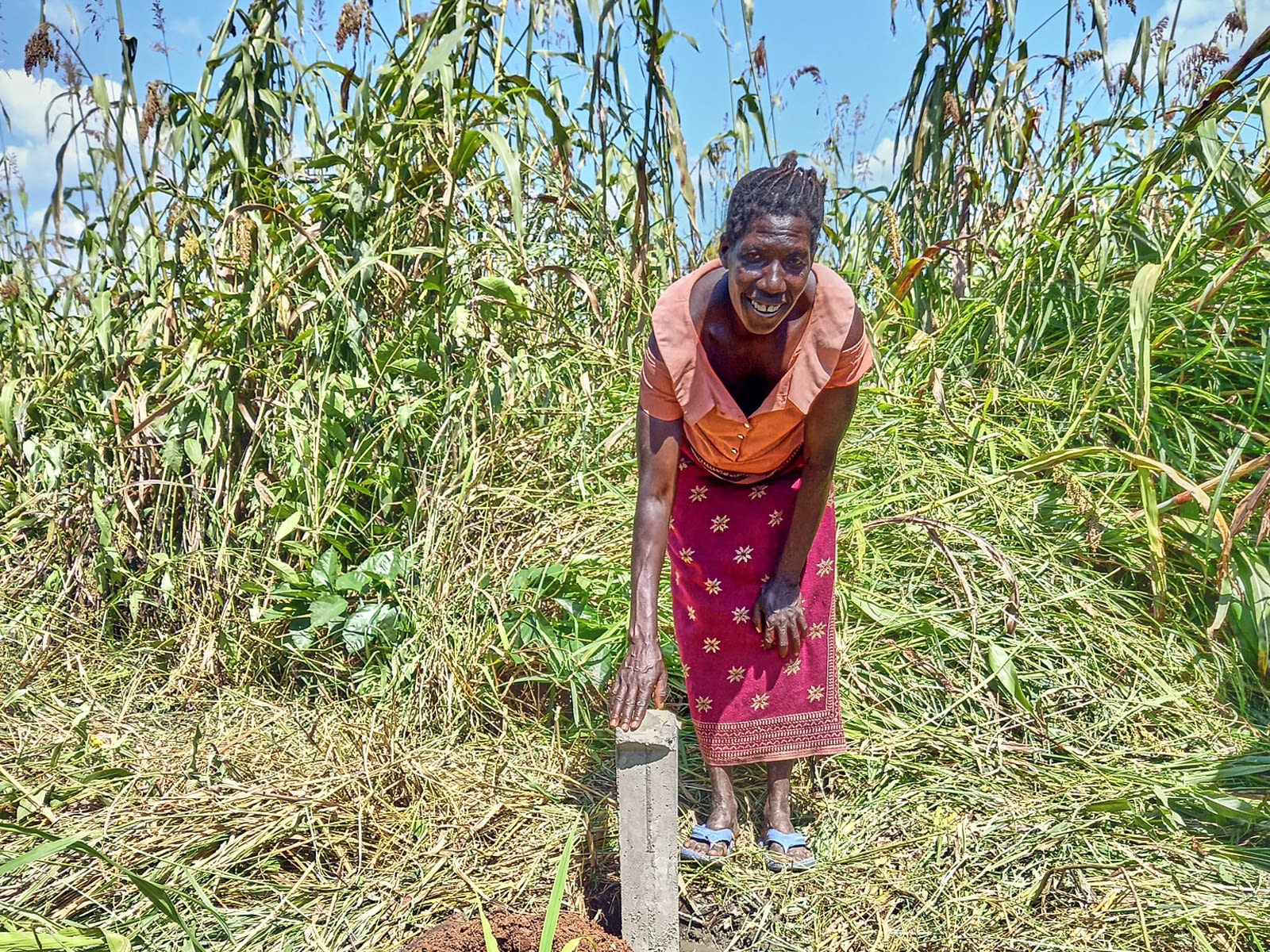 Sylvia stands by a boundary marker.