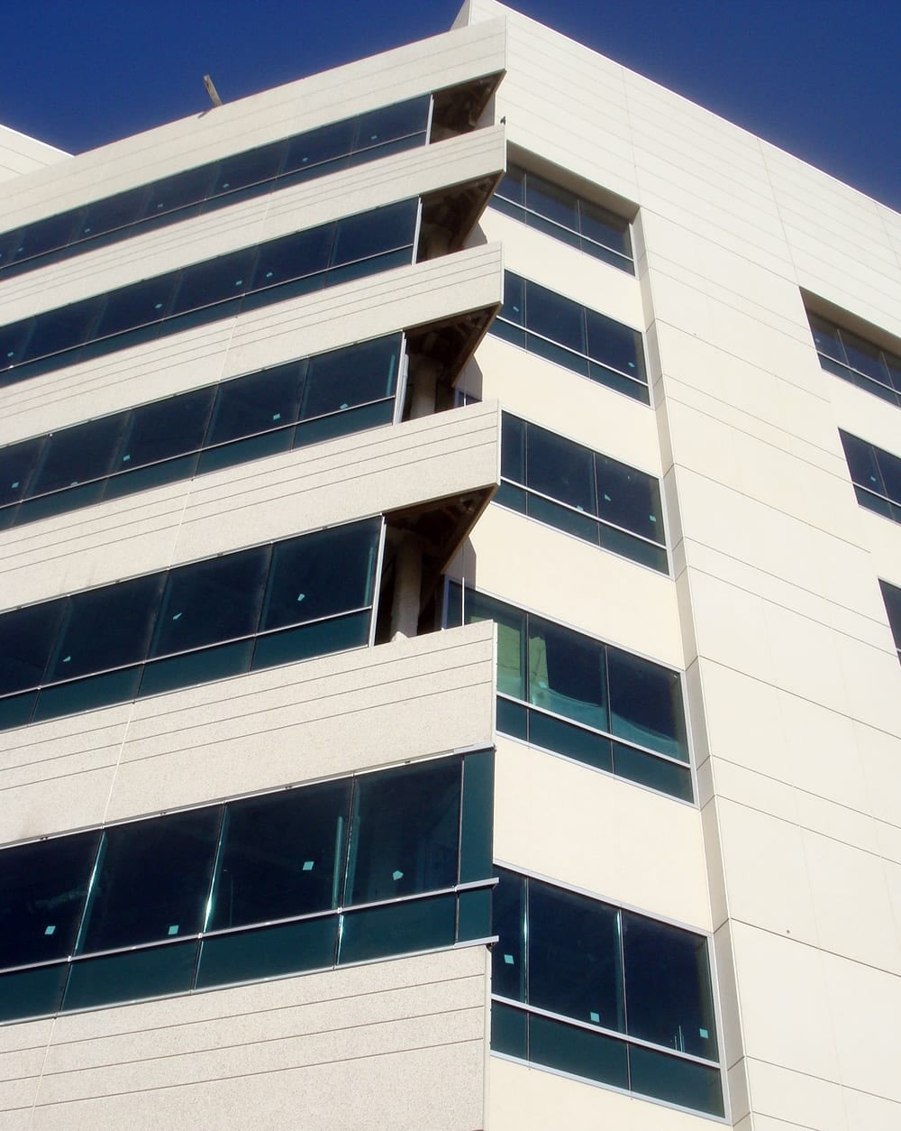 Modern office building with blue tinted windows.
