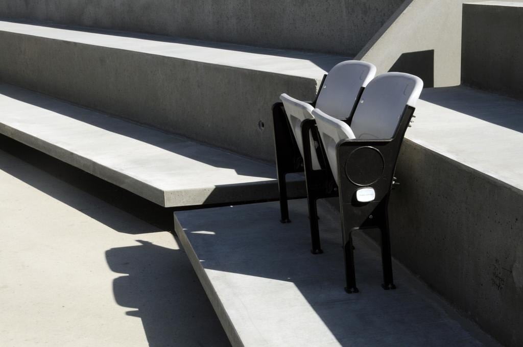 Empty stadium seats on concrete steps