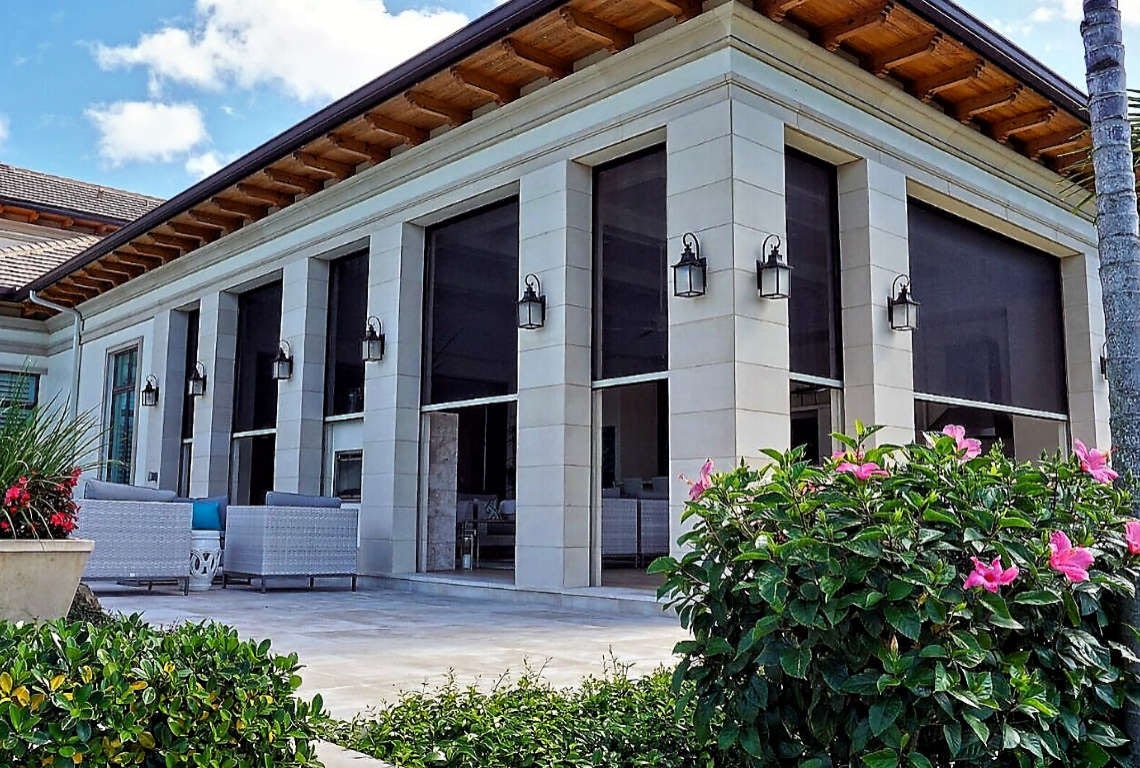 Modern patio with large windows and flowers