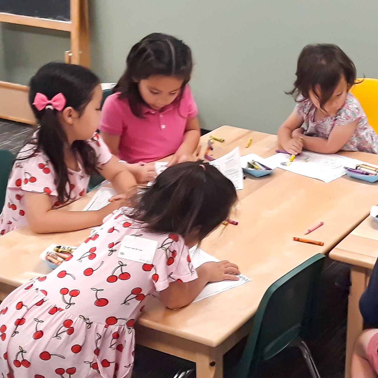 Children working on a craft at a table