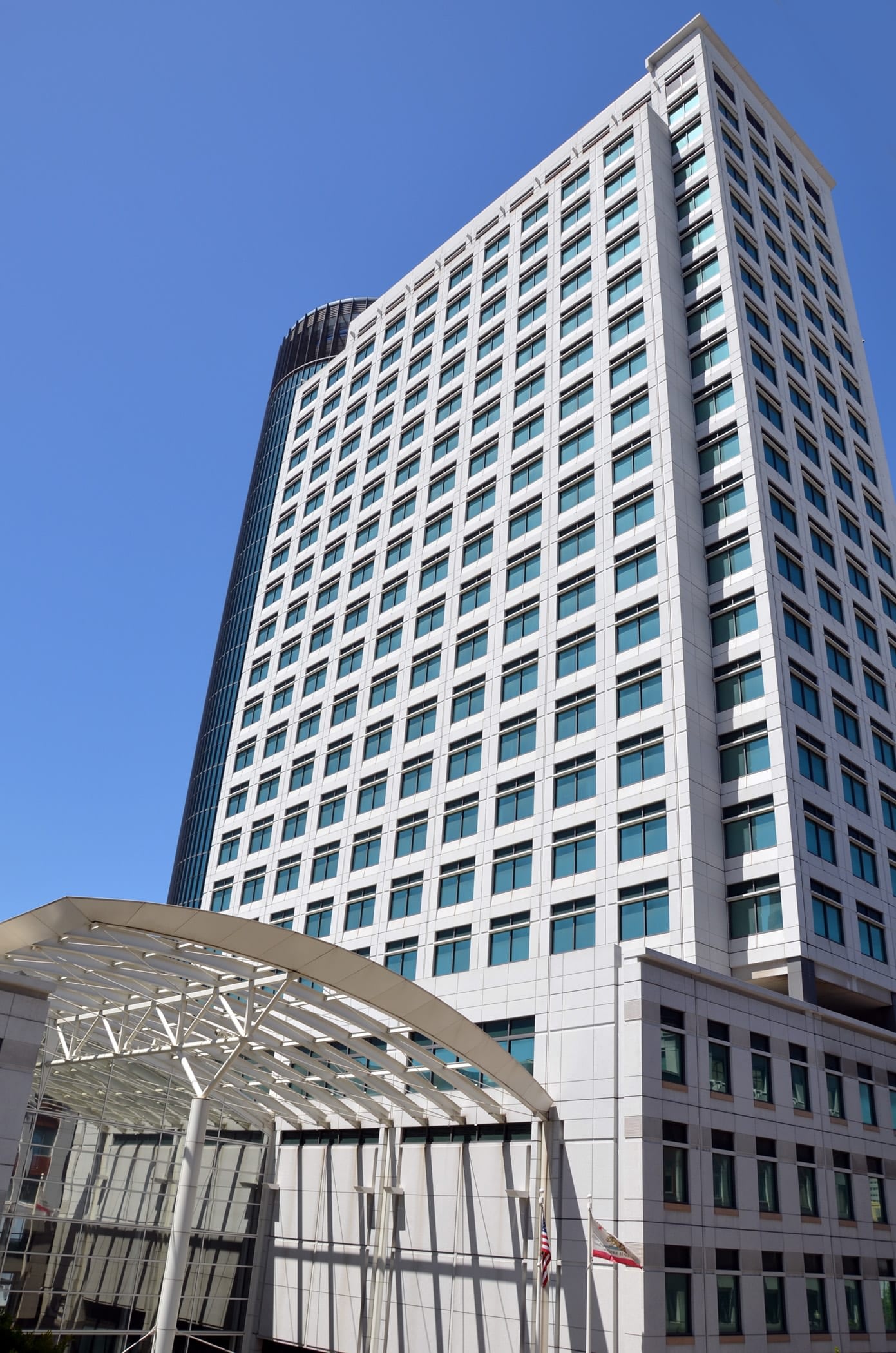 Modern high-rise office building against blue sky