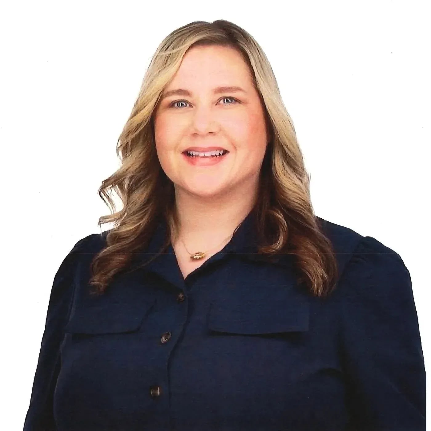 Professional headshot of smiling woman with blonde hair