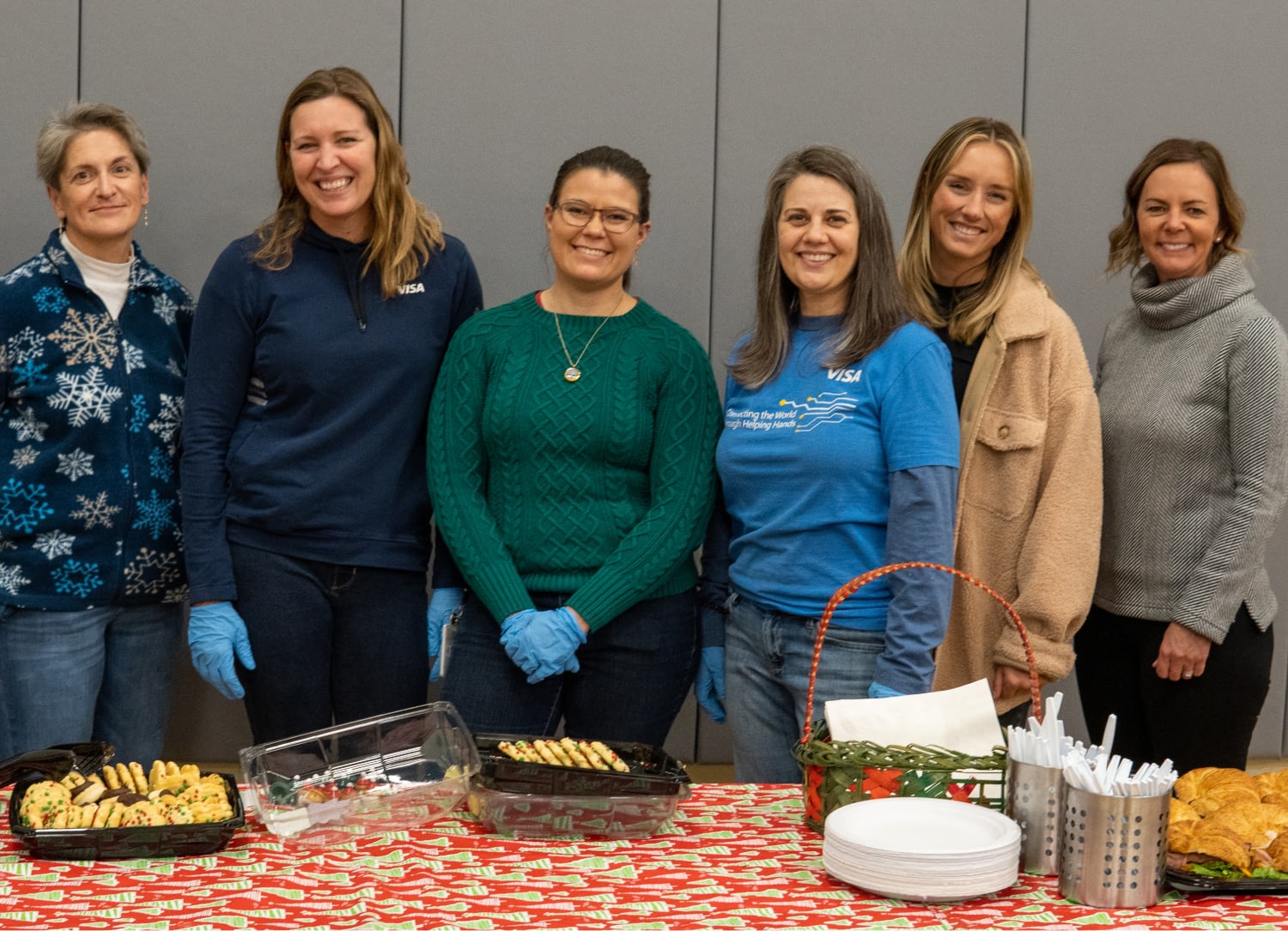 Group of women volunteering at a food event.
