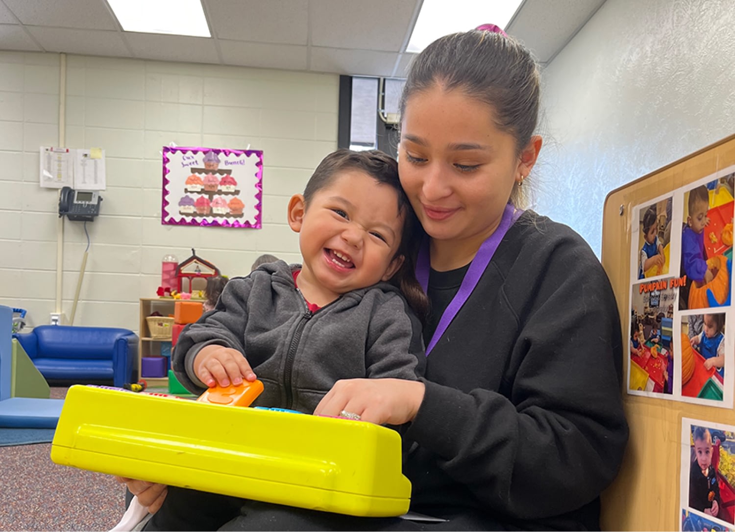 Child playing with educational toy.