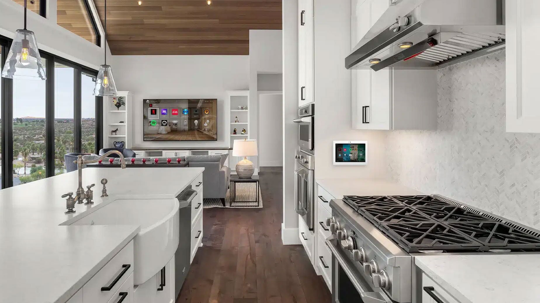 Modern white kitchen with farmhouse sink and gas range
