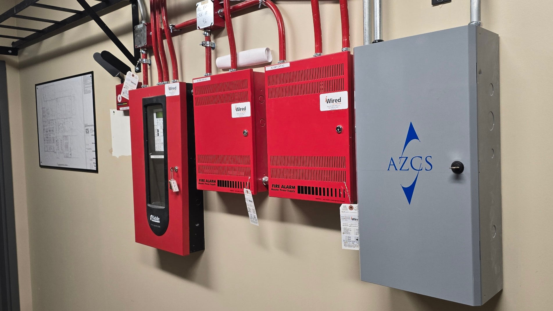 Wall-mounted fire alarm control panels and electrical cabinet