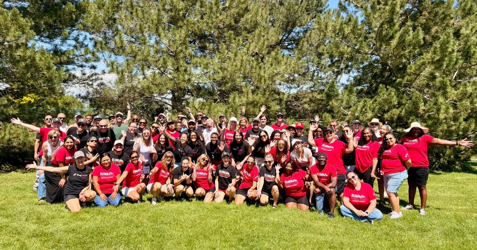 Large group in red and black shirts outdoors