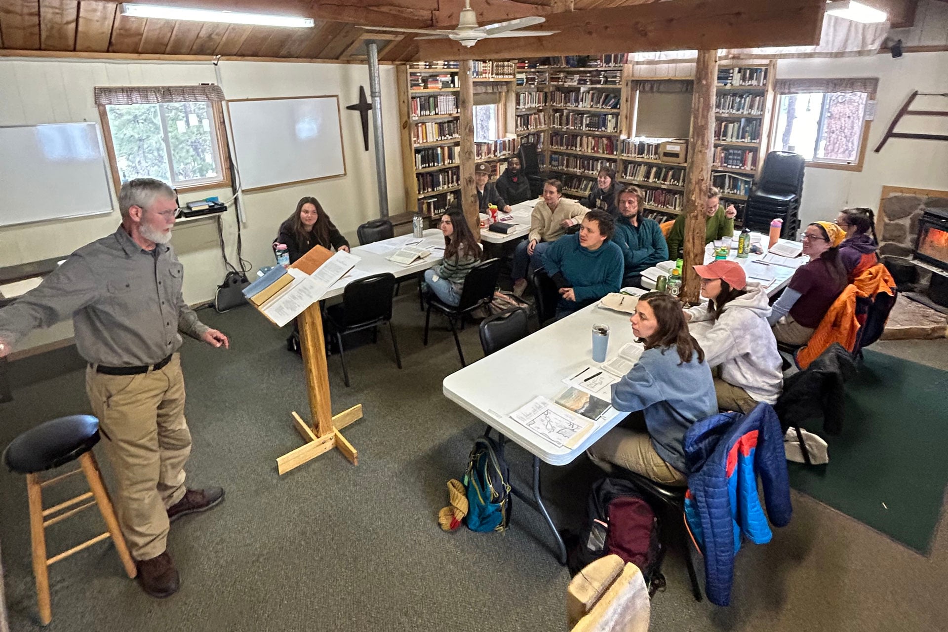 Instructor teaching students in cozy library classroom