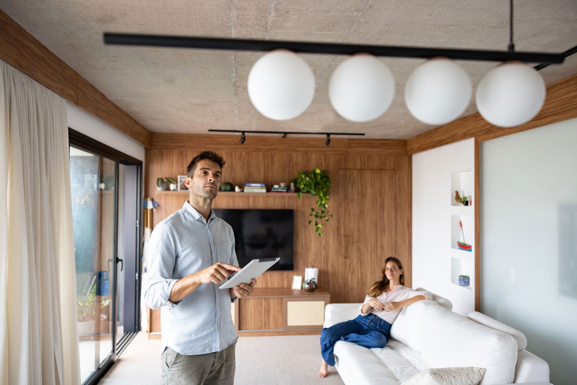 Man using tablet in modern living room