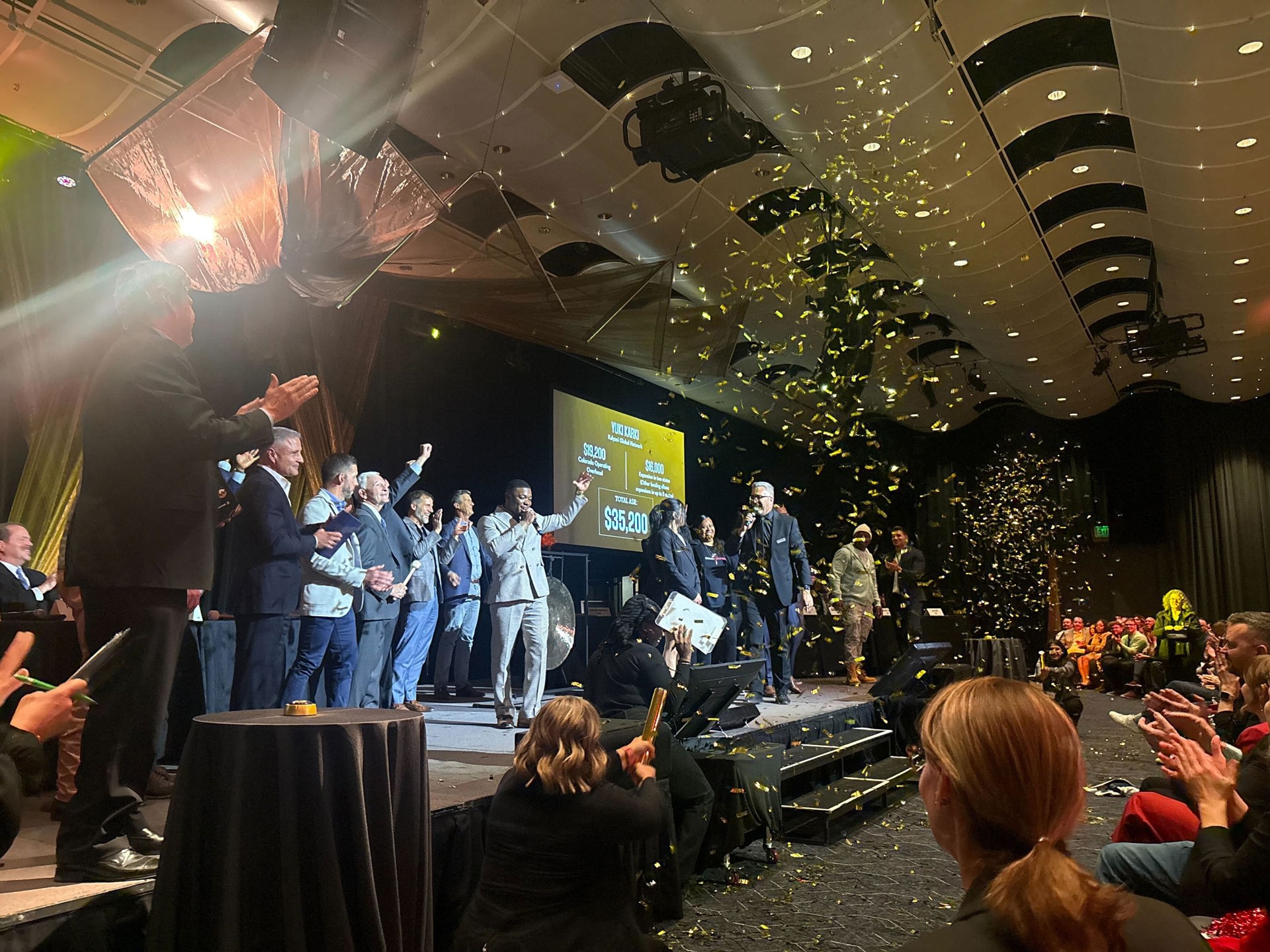 Confetti falls during an award ceremony onstage