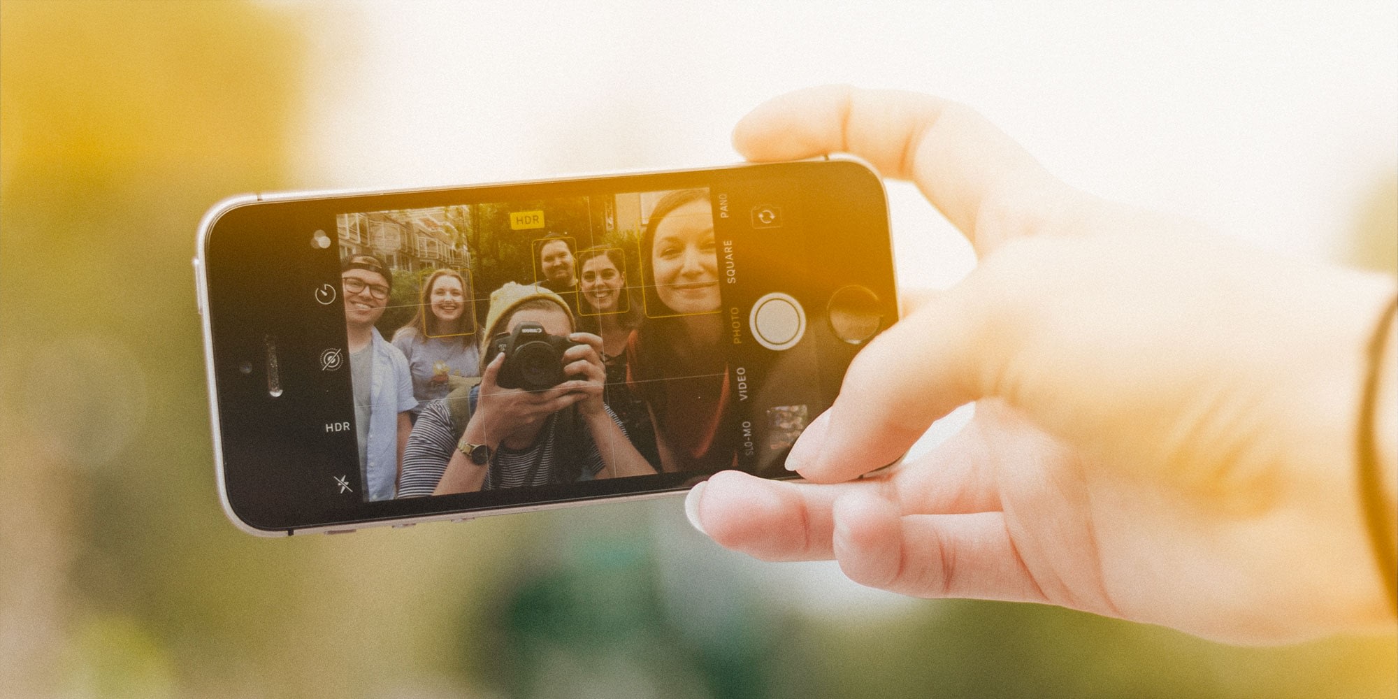 Young adults having some fun taking a selfie at sunset
