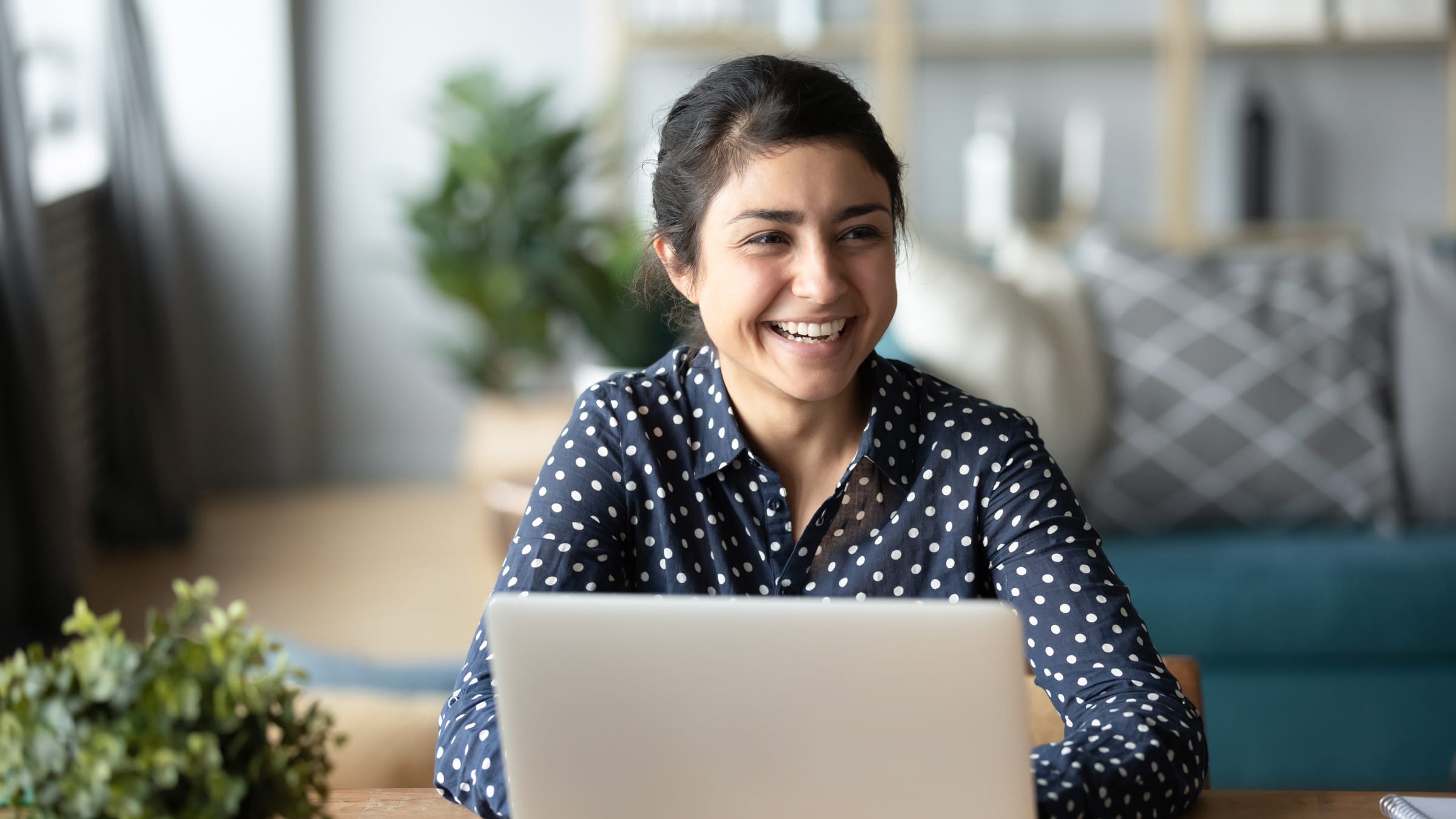 Young woman works at a web design agency in Colorado Springs.