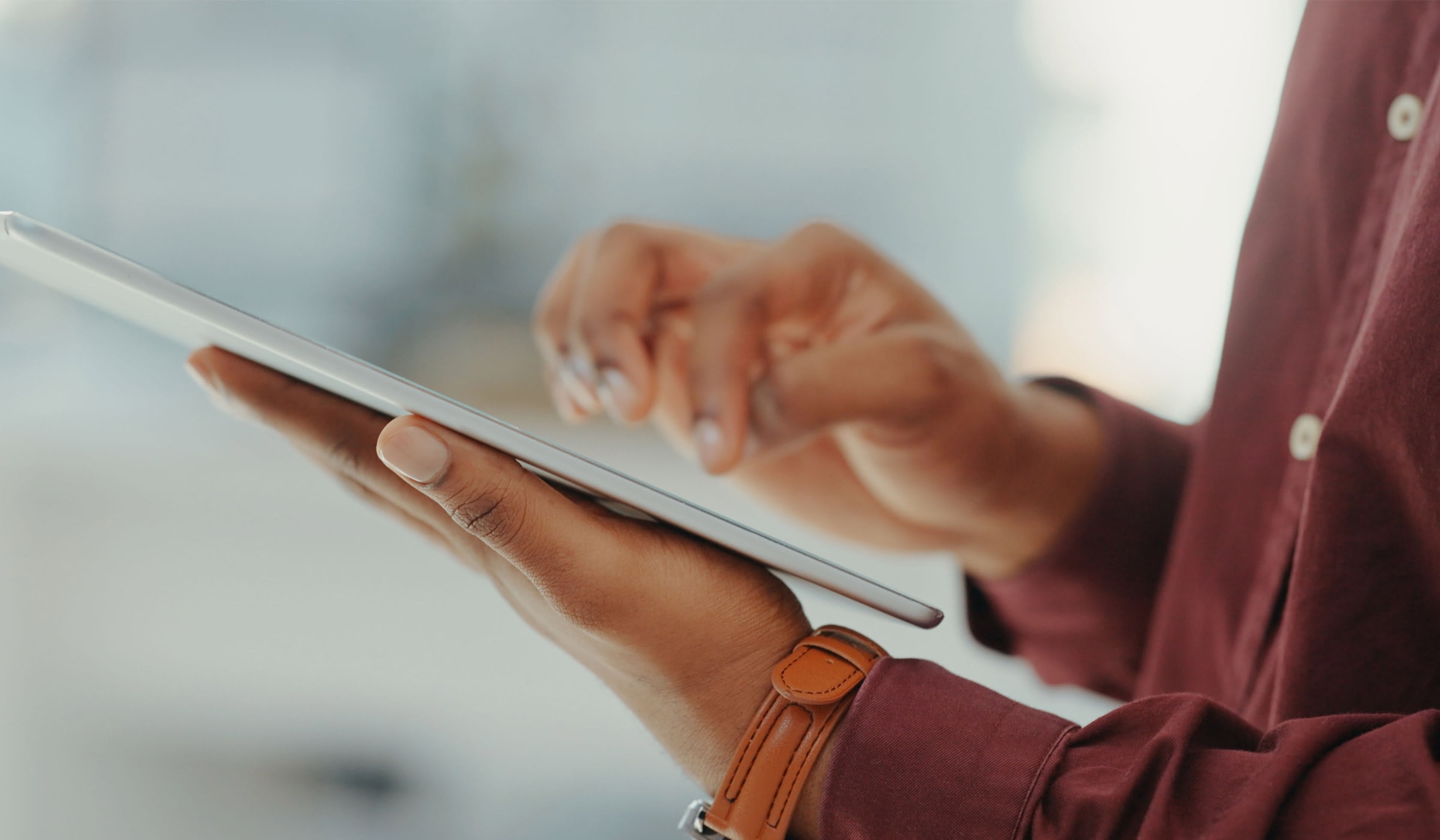 Person using a tablet with one hand