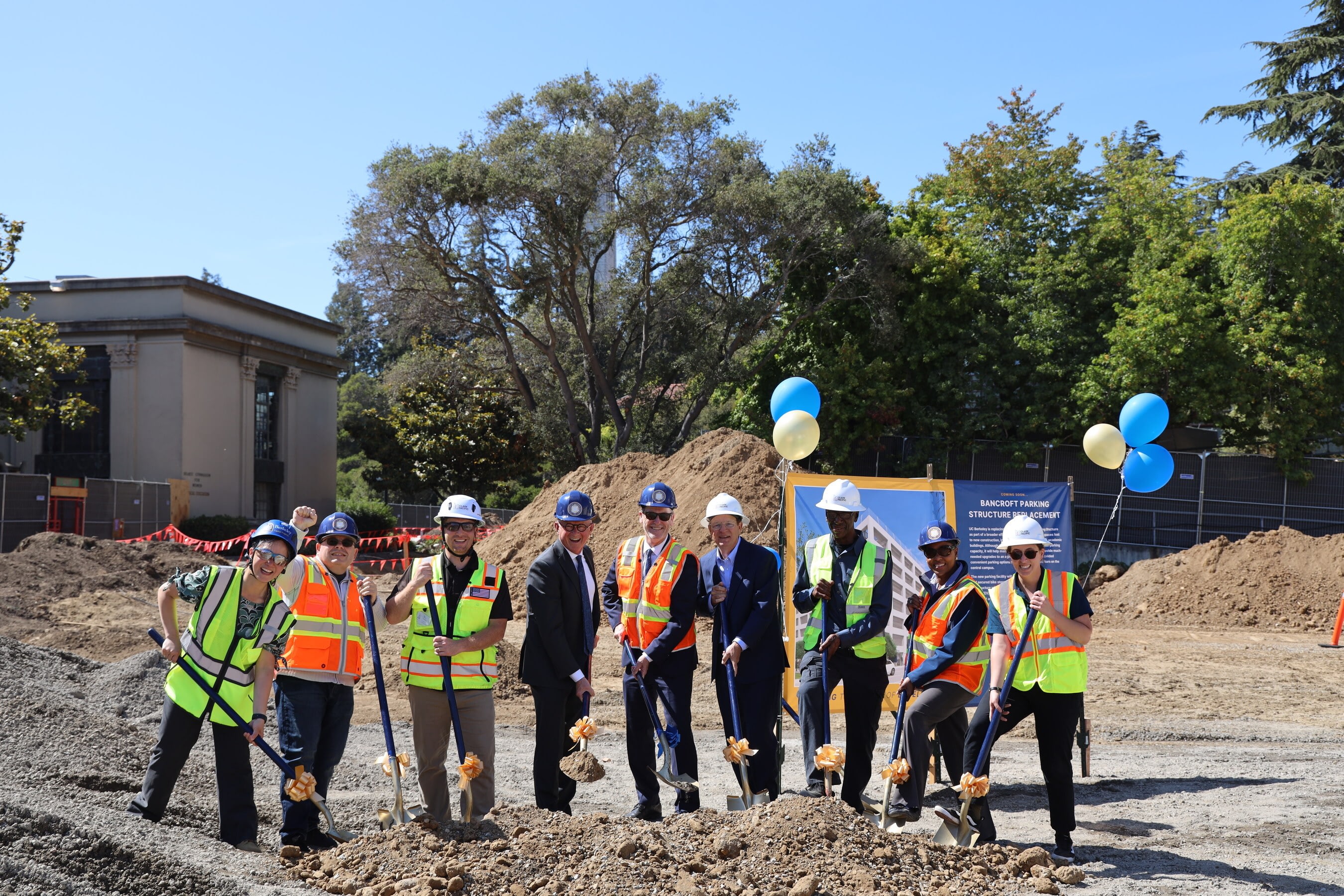 A group of people wearing hard hats at the groundbreaking for UC Berkeley's new Bancroft Parking Structure.