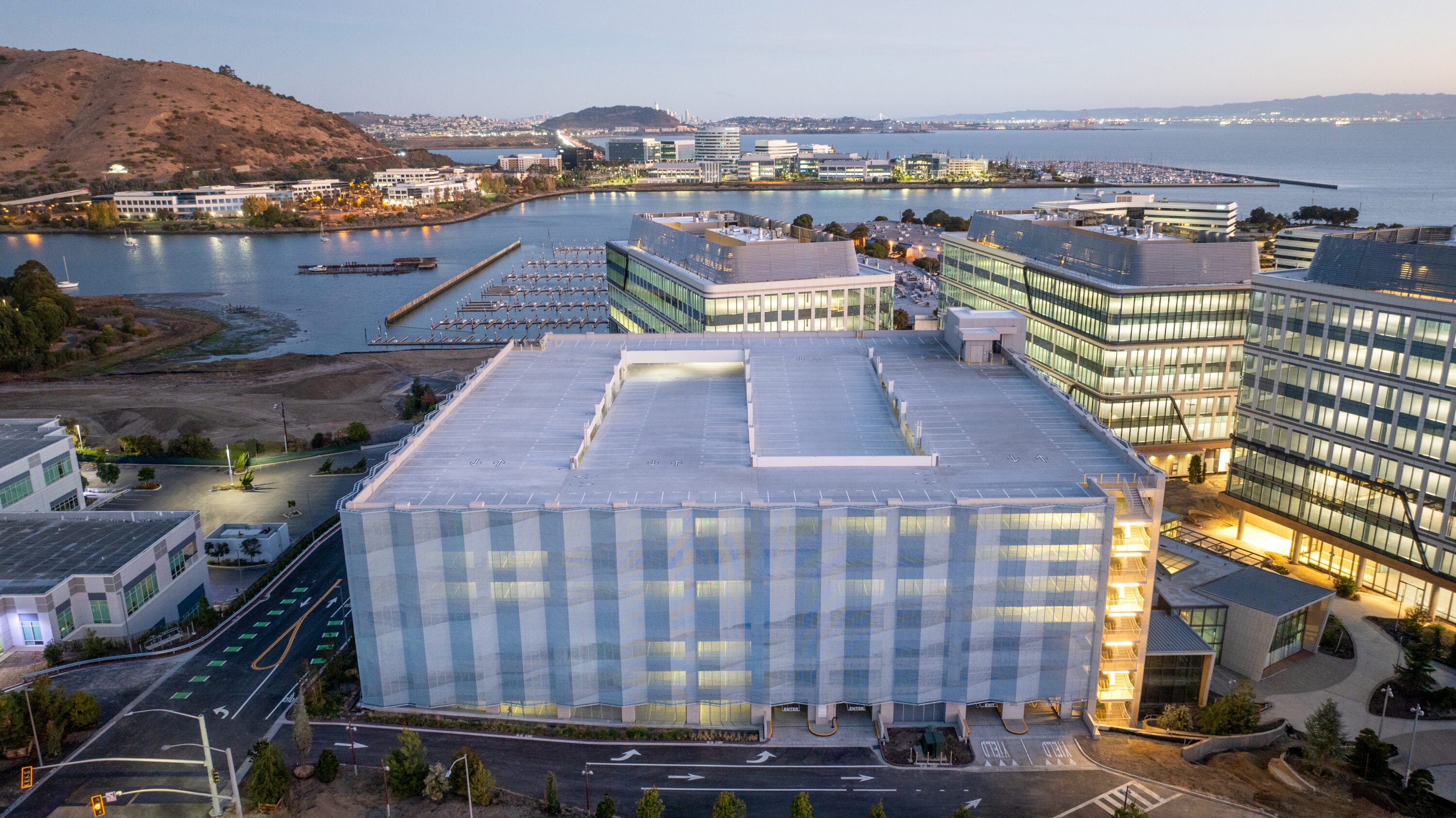 Modern waterfront office buildings at sunset