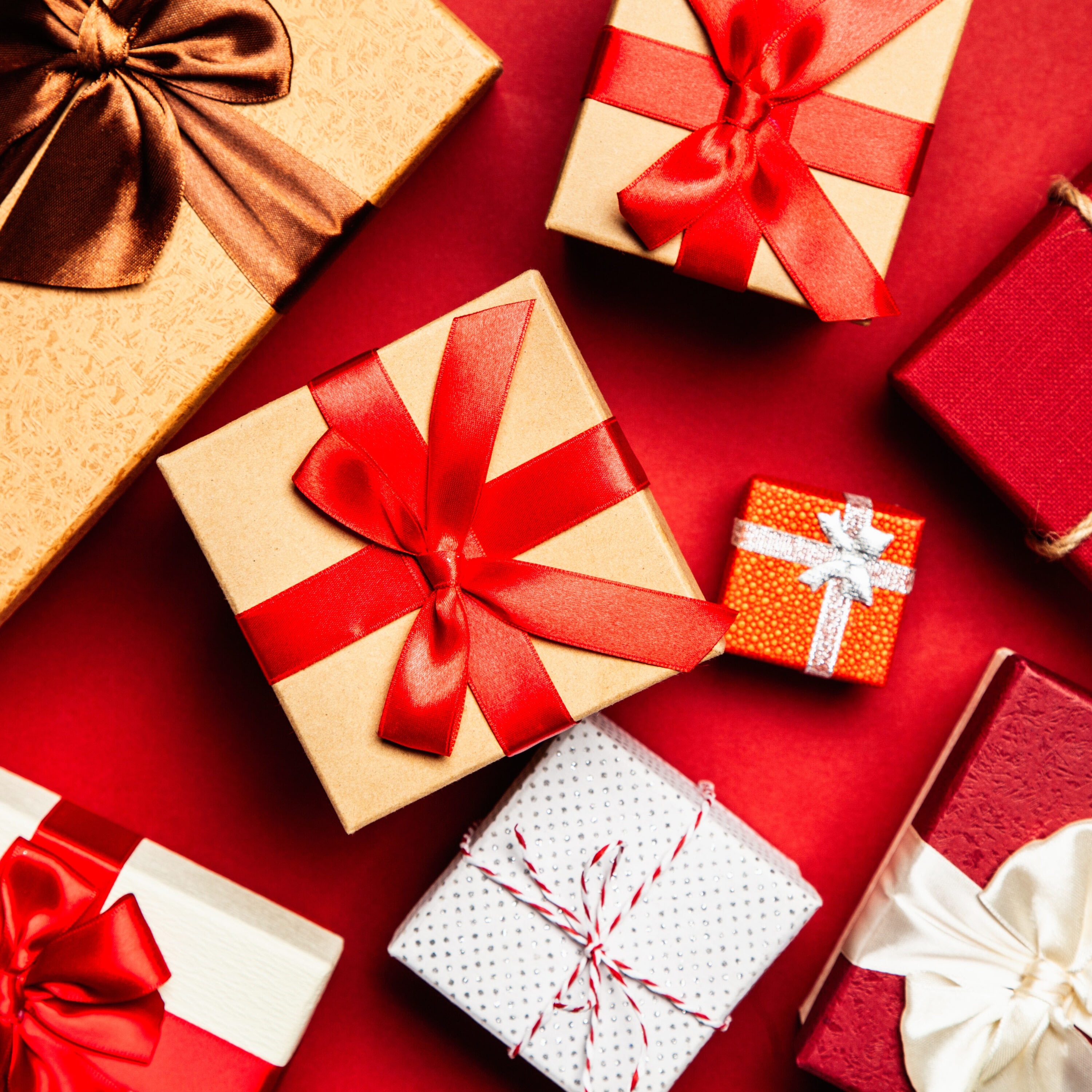 Colorful gift boxes with red ribbons