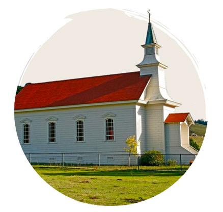 Meeting for prayer at a church with a red roof.