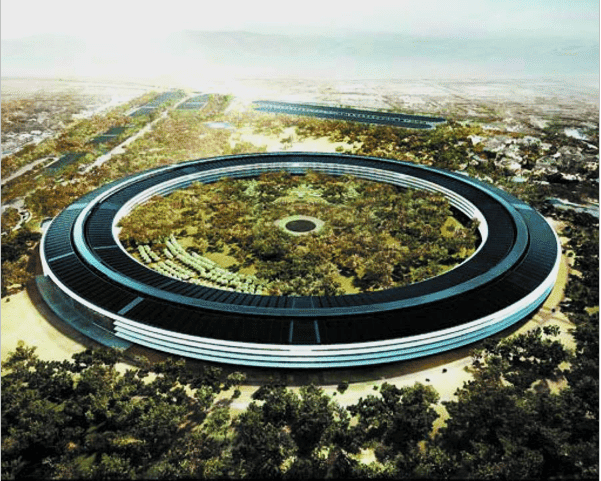 Futuristic circular building surrounded by trees.