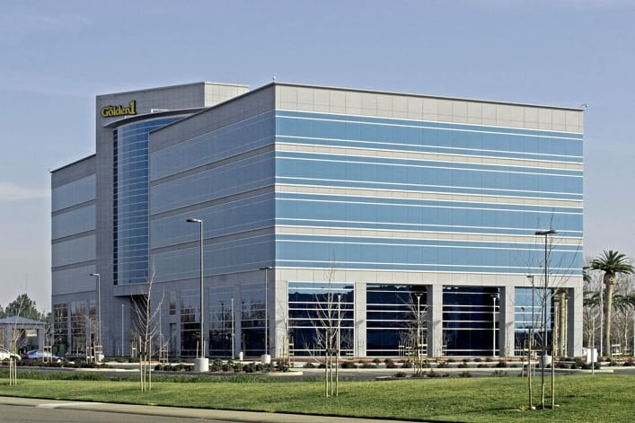 Modern multi-story office building with glass facade