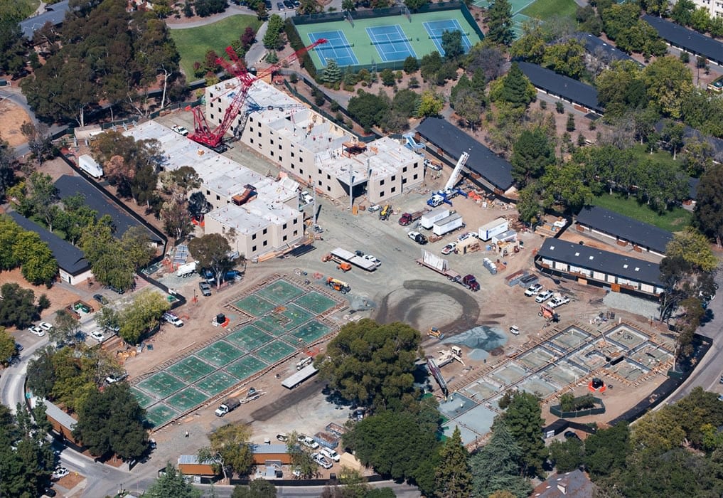 Aerial view of waterfront buildings and pier