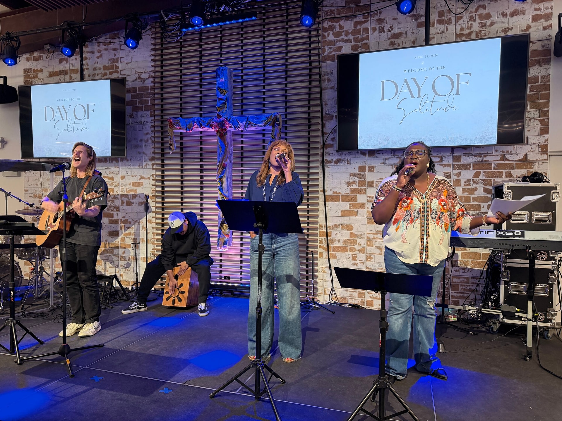 Staff members lead a worship service